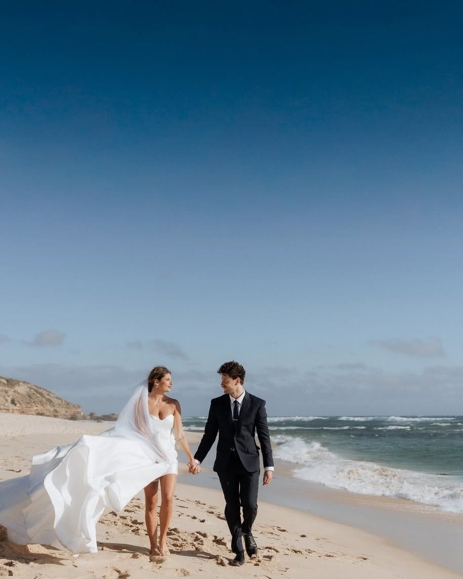 Bride and groom on a Melbourne beach at golden hour